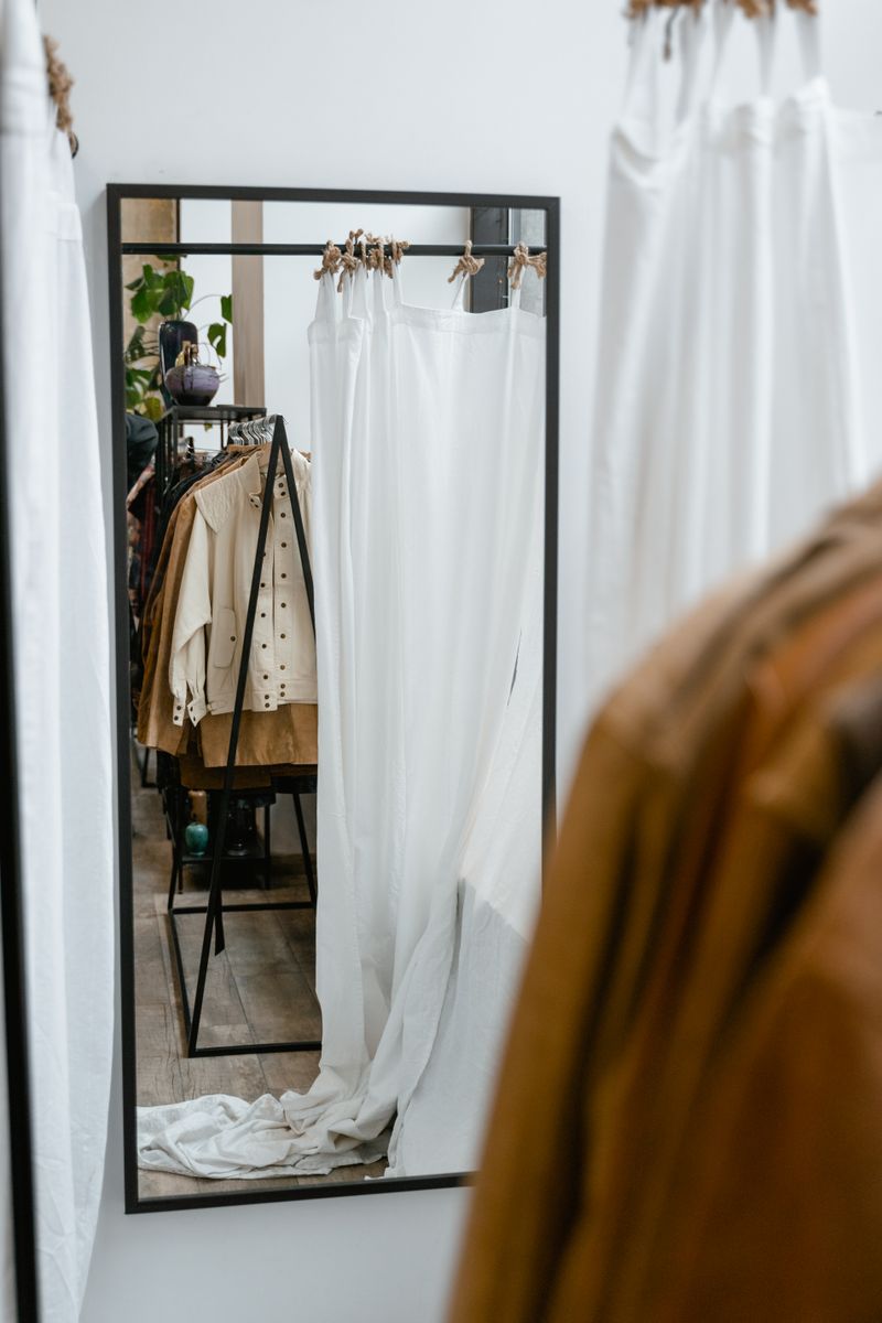A boutique clothing rail in warm light
